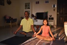 Father and child practicing mindful meditation together